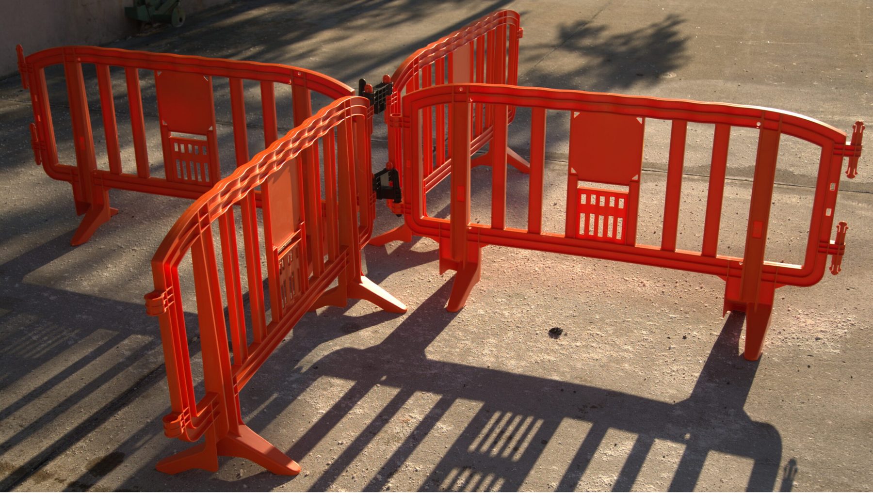 Orange Movit barricades joined at an angle with a connector